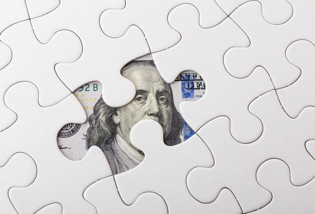 White puzzle with American dollar